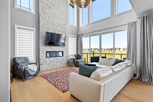 52 Evansfield Manor Nw, Calgary, AB - Indoor Photo Showing Living Room With Fireplace
