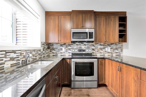 354 Legacy Village Way Se, Calgary, AB - Indoor Photo Showing Kitchen With Stainless Steel Kitchen With Double Sink With Upgraded Kitchen