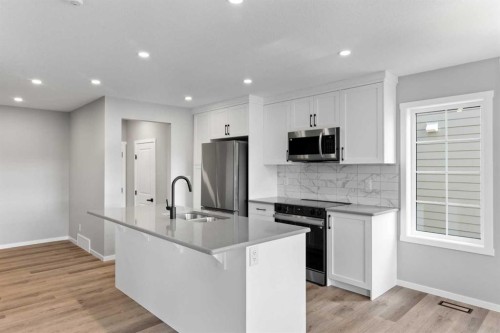 225 Yorkville Boulevard Sw, Calgary, AB - Indoor Photo Showing Kitchen With Stainless Steel Kitchen With Upgraded Kitchen