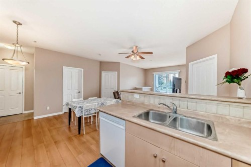2115-1140 Taradale Drive Ne, Calgary, AB - Indoor Photo Showing Kitchen With Double Sink