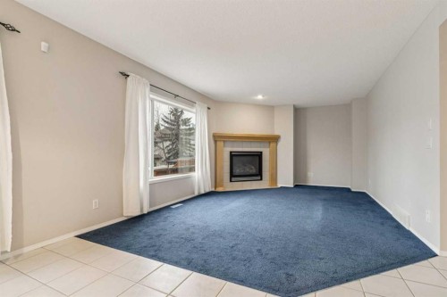 146 Everwillow Close Sw, Calgary, AB - Indoor With Fireplace