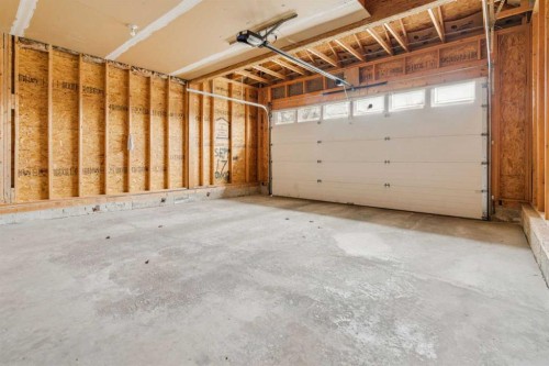 146 Everwillow Close Sw, Calgary, AB - Indoor Photo Showing Garage
