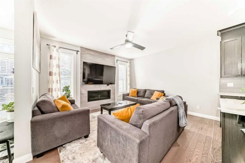 423 Redstone Drive Ne, Calgary, AB - Indoor Photo Showing Living Room With Fireplace