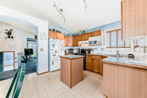 128 Erin Meadow Way Se, Calgary, AB - Indoor Photo Showing Kitchen With Double Sink