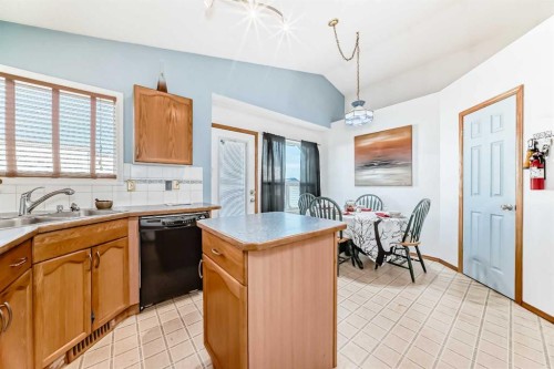 128 Erin Meadow Way Se, Calgary, AB - Indoor Photo Showing Kitchen With Double Sink