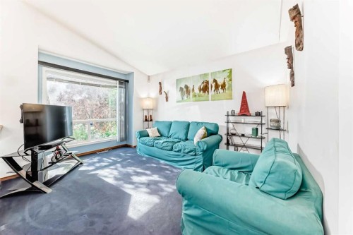 128 Erin Meadow Way Se, Calgary, AB - Indoor Photo Showing Living Room