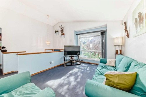 128 Erin Meadow Way Se, Calgary, AB - Indoor Photo Showing Living Room