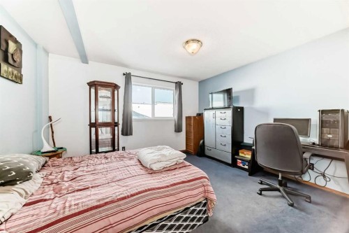 128 Erin Meadow Way Se, Calgary, AB - Indoor Photo Showing Bedroom
