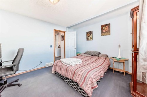 128 Erin Meadow Way Se, Calgary, AB - Indoor Photo Showing Bedroom