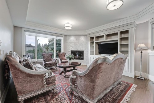 32 Aspen Ridge Manor Sw, Calgary, AB - Indoor With Fireplace