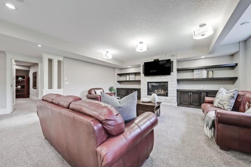 32 Aspen Ridge Manor Sw, Calgary, AB - Indoor Photo Showing Living Room With Fireplace