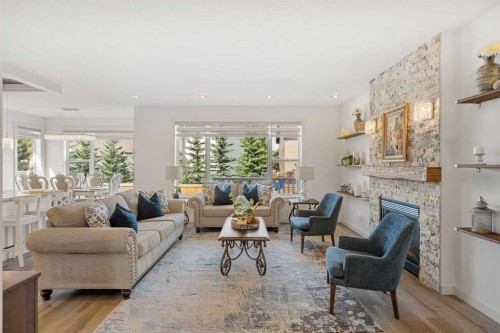 808 Coopers Square Sw, Airdrie, AB - Indoor Photo Showing Living Room With Fireplace