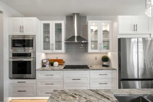 808 Coopers Square Sw, Airdrie, AB - Indoor Photo Showing Kitchen With Double Sink With Upgraded Kitchen