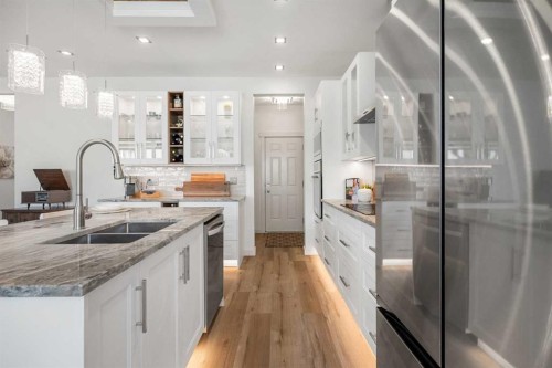 808 Coopers Square Sw, Airdrie, AB - Indoor Photo Showing Kitchen With Double Sink With Upgraded Kitchen