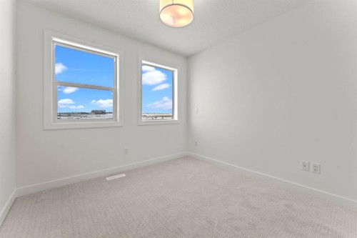99 Raven Point Se, Calgary, AB - Indoor Photo Showing Other Room