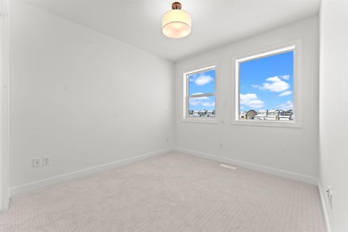 99 Raven Point Se, Calgary, AB - Indoor Photo Showing Other Room