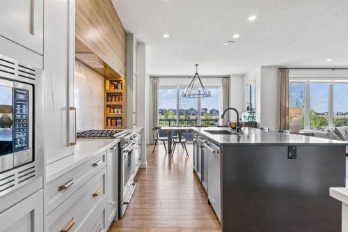 656 Bayview Way Sw, Airdrie, AB - Indoor Photo Showing Kitchen With Upgraded Kitchen