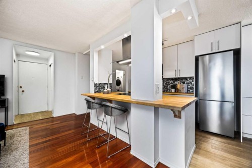 101-316 Cedar Crescent Sw, Calgary, AB - Indoor Photo Showing Kitchen With Stainless Steel Kitchen