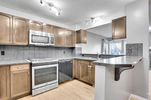 229 Luxstone Way Sw, Airdrie, AB - Indoor Photo Showing Kitchen