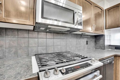 229 Luxstone Way Sw, Airdrie, AB - Indoor Photo Showing Kitchen