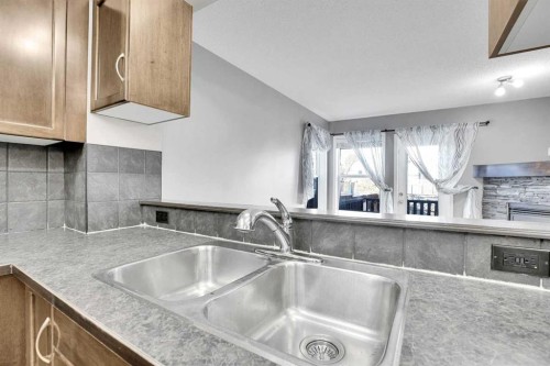 229 Luxstone Way Sw, Airdrie, AB - Indoor Photo Showing Kitchen With Double Sink