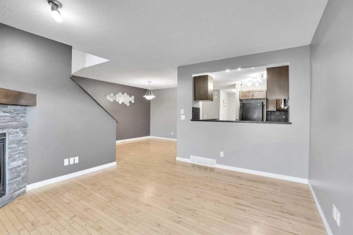 229 Luxstone Way Sw, Airdrie, AB - Indoor With Fireplace