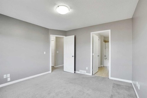 229 Luxstone Way Sw, Airdrie, AB - Indoor Photo Showing Other Room