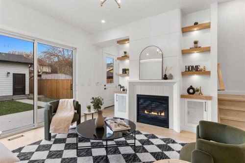 2325 23 Street Nw, Calgary, AB - Indoor Photo Showing Living Room With Fireplace