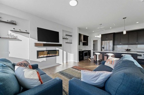 126 Howse Common Ne, Calgary, AB - Indoor Photo Showing Living Room With Fireplace