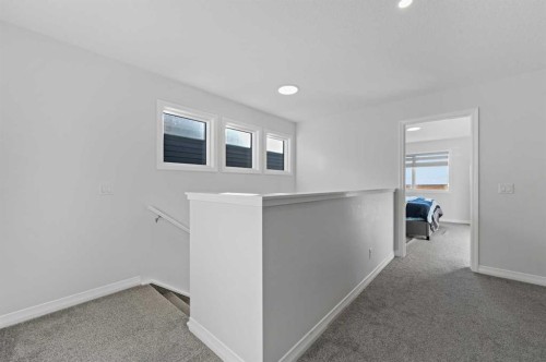 126 Howse Common Ne, Calgary, AB - Indoor Photo Showing Other Room