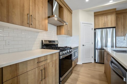585 Corner Meadows Way Ne, Calgary, AB - Indoor Photo Showing Kitchen With Double Sink With Upgraded Kitchen