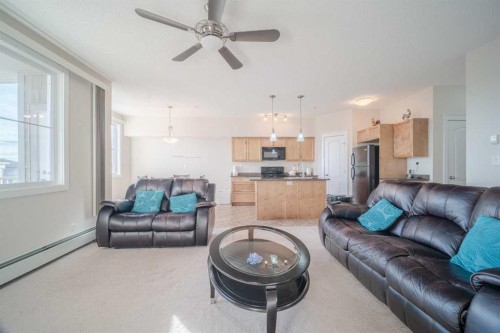 1202-2370 Bayside Road Sw, Airdrie, AB - Indoor Photo Showing Living Room