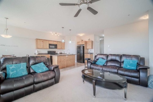 1202-2370 Bayside Road Sw, Airdrie, AB - Indoor Photo Showing Living Room