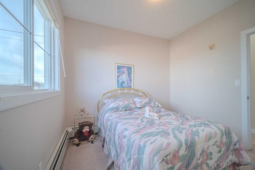 1202-2370 Bayside Road Sw, Airdrie, AB - Indoor Photo Showing Bedroom