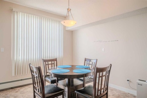 1202-2370 Bayside Road Sw, Airdrie, AB - Indoor Photo Showing Dining Room