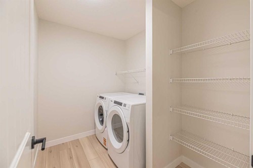 65 Amblefield View Nw, Calgary, AB - Indoor Photo Showing Laundry Room