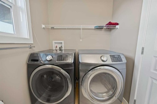 82 Panatella Road Nw, Calgary, AB - Indoor Photo Showing Laundry Room