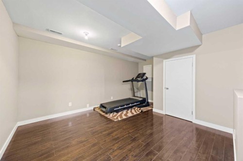 82 Panatella Road Nw, Calgary, AB - Indoor Photo Showing Gym Room