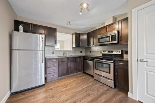 82 Panatella Road Nw, Calgary, AB - Indoor Photo Showing Kitchen With Stainless Steel Kitchen