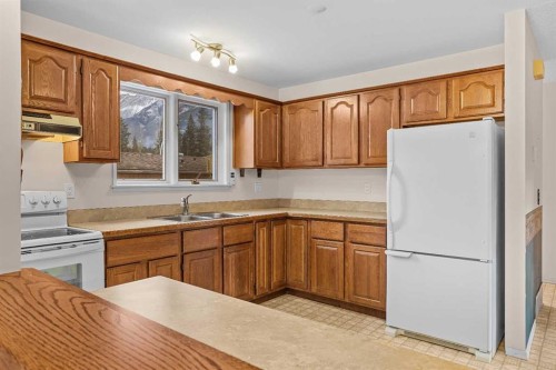 113 Larch Place, Canmore, AB - Indoor Photo Showing Kitchen With Double Sink