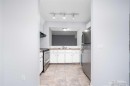 602-919 38 Street Ne, Calgary, AB  - Indoor Photo Showing Kitchen With Double Sink 