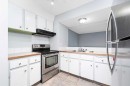 602-919 38 Street Ne, Calgary, AB  - Indoor Photo Showing Kitchen With Double Sink 