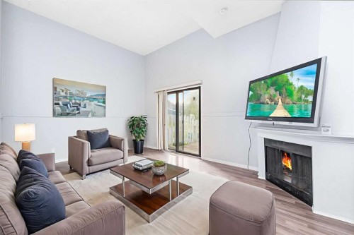 602-919 38 Street Ne, Calgary, AB - Indoor Photo Showing Living Room With Fireplace