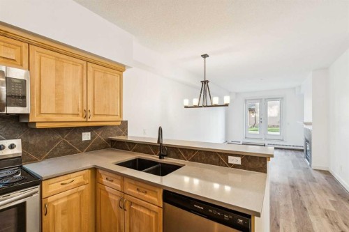 2107-1888 Signature Park Sw, Calgary, AB - Indoor Photo Showing Kitchen With Double Sink