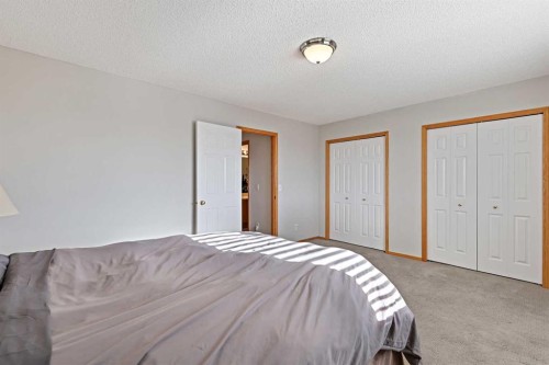 258 Rocky Ridge Court Nw, Calgary, AB - Indoor Photo Showing Bedroom