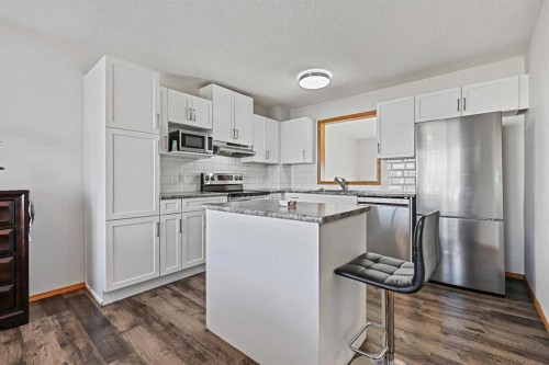 258 Rocky Ridge Court Nw, Calgary, AB - Indoor Photo Showing Kitchen With Stainless Steel Kitchen With Upgraded Kitchen