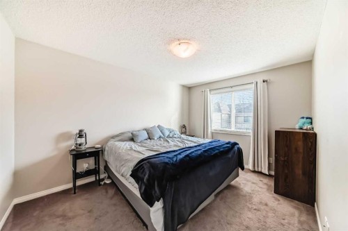 3140 Windsong Boulevard Sw, Airdrie, AB - Indoor Photo Showing Bedroom