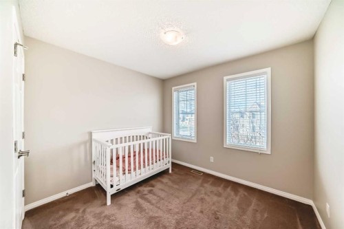 3140 Windsong Boulevard Sw, Airdrie, AB - Indoor Photo Showing Bedroom