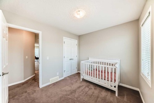 3140 Windsong Boulevard Sw, Airdrie, AB - Indoor Photo Showing Bedroom