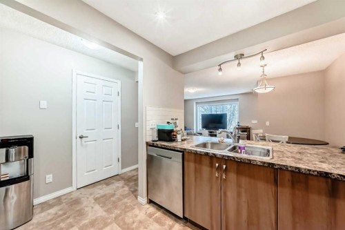 3140 Windsong Boulevard Sw, Airdrie, AB - Indoor Photo Showing Kitchen With Double Sink